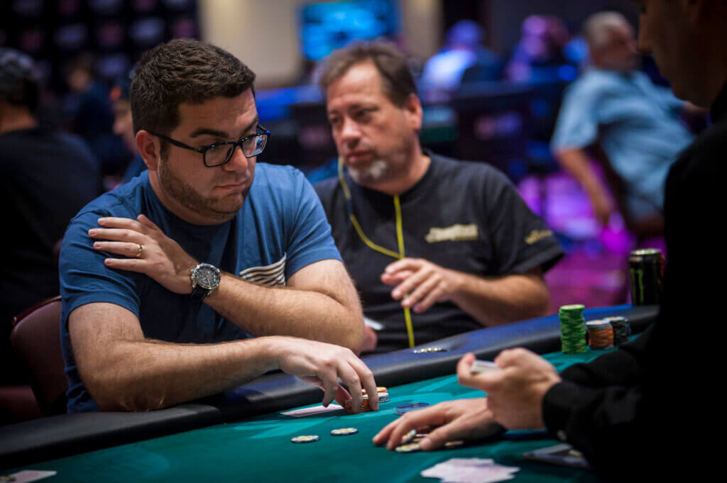 Poker pro Filipp Khavin was shot in the stomach in the car park of a Florida poker room is suing the owners for negligence.